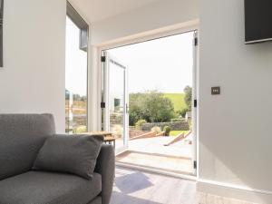 Televiisor ja/või meelelahutuskeskus majutusasutuses Ghyll Cottage