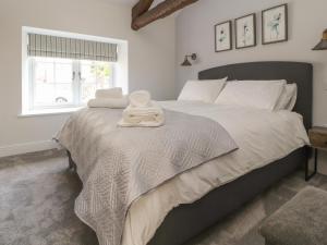 Voodi või voodid majutusasutuse Ghyll Cottage toas