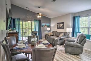 a living room with a table and chairs at Pristine Holiday Hills Resort Condo in Branson! in Branson