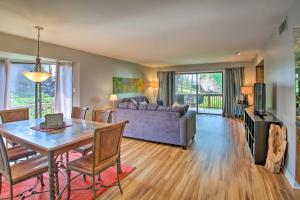 a living room with a table and a couch at Sunny Hot Springs Hotspot at North Shore Condos! in Hot Springs