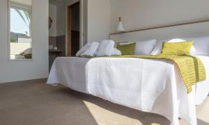 מיטה או מיטות בחדר ב-Hotel Senderos