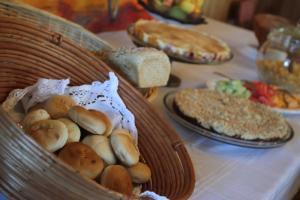 a basket of bread and other foods on a table at Playa Maqui Lodge in Frutillar