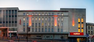 a large building with a clock on the side of it at easyHotel Sheffield in Sheffield