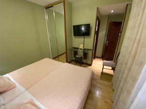 Postel nebo postele na pokoji v ubytování Hostal Concejo