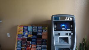 an atm machine sitting next to a wall at Holly Crest Hotel - Los Angeles, LAX Airport in Inglewood +23 photos