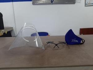 a pair of glasses sitting on top of a table at Zafara Hotel in Santa Marta