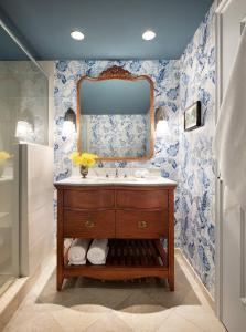 a bathroom with a sink and a mirror at Graduate Chapel Hill in Chapel Hill