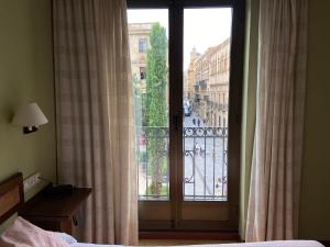 Postel nebo postele na pokoji v ubytování Hostal Concejo