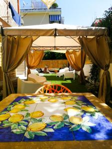 a table with a blue and yellow table cloth on it at AlbaChiara B&B in Gaeta