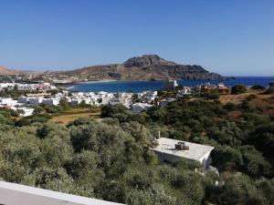 a view of a town and a body of water at Eleonas in Plakias