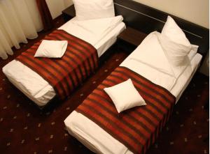 Postel nebo postele na pokoji v ubytování Hotel Roberts + 21 fotografií