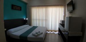 Postel nebo postele na pokoji v ubytování Hotel & Suites Domani
