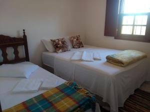 Uma cama ou camas num quarto em Casa Mestre Ataíde
