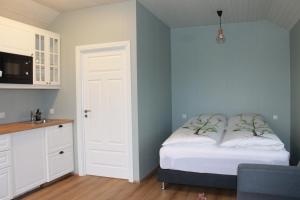מיטה או מיטות בחדר ב-Sólheimagerði Guesthouse