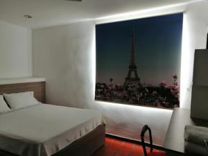 Postel nebo postele na pokoji v ubytování Hotel 42 Avenida