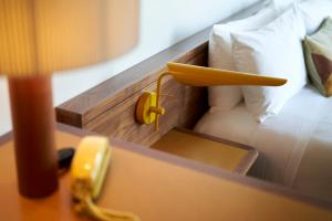 Postel nebo postele na pokoji v ubytování Hotel Magdalena