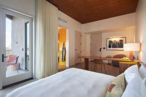 Postel nebo postele na pokoji v ubytování Hotel Magdalena
