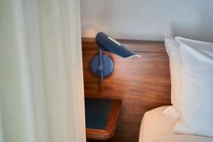 Postel nebo postele na pokoji v ubytování Hotel Magdalena