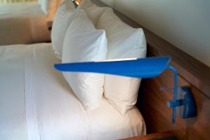 Postel nebo postele na pokoji v ubytování Hotel Magdalena