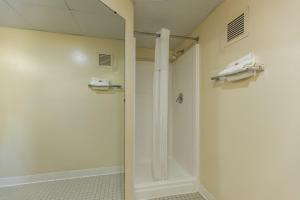 a shower stall in a bathroom with a shower at Days Inn by Wyndham Kuttawa/Eddyville in Kuttawa