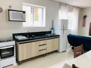 Kuchyň nebo kuchyňský kout v ubytování Residencial Spader - Bombinhas