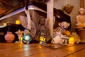 a group of vases and statues on a table at Martonys Zen Garden in San Francisco