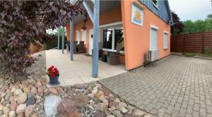 a building with a potted plant sitting outside of it at FerienHaus Zur Sonne, Zislow in Zislow