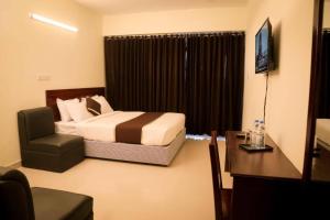 Hotel Golden Hill tesisinde bir odada yatak veya yataklar