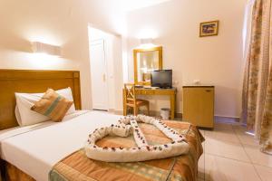 Postel nebo postele na pokoji v ubytování Hapi Hotel