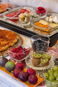 a table topped with lots of different types of food at Logis Hôtel Villa Victorine in Nice