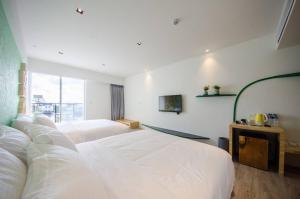 เตียงในห้องที่ 墾丁山風足跡