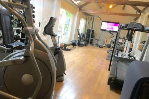 a gym with treadmills and exercise equipment in a room at Apartment 61 in Wetherby