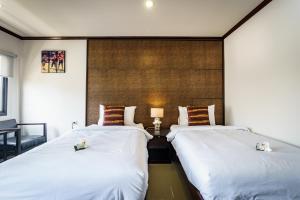 Postel nebo postele na pokoji v ubytování Lux Boutique Hotel