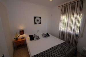 A bed or beds in a room at Mare Nostrum 422