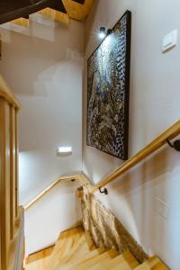 a staircase in a house with a painting on the wall at Villa Nicola in Kissamos