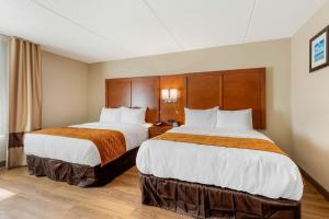 מיטה או מיטות בחדר ב-Comfort Inn & Suites