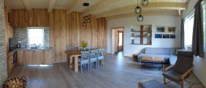 a kitchen and living room with a couch and a table at Apartmán Nežichov in Toužim