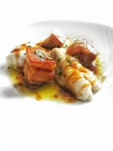 a plate of food on a white plate at Axel Hotel San Sebastián - Adults Only in Donostia-San Sebastián