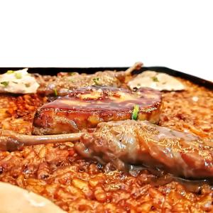 a close up of a plate of food with meat at Axel Hotel San Sebastián - Adults Only in Donostia-San Sebastián