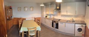 a kitchen with a table and a sink at George's House - 1 Leacklee in Manish +23 photos