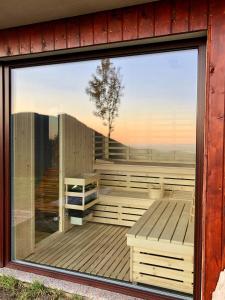 a window of a house with a view of a deck at Kopiše in Zoll