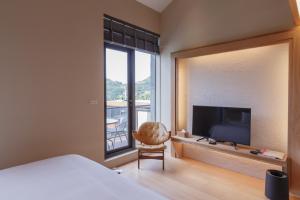 TV a/nebo společenská místnost v ubytování 金漫會館-金瓜石九份景觀民宿-Jien Mount Villas