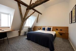 Uma cama ou camas num quarto em Hotel Messeyne