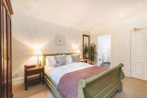 A bed or beds in a room at Craigellachie Hotel of Speyside 