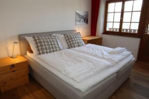 Voodi või voodid majutusasutuse Hotel Surselva toas