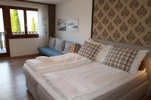 Voodi või voodid majutusasutuse Hotel Surselva toas