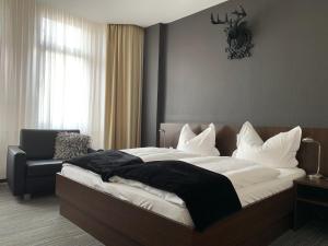 Postel nebo postele na pokoji v ubytování Hotel Lindenhof