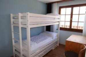 Voodi või voodid majutusasutuse Hotel Surselva toas