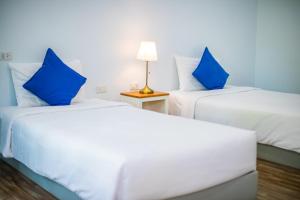 מיטה או מיטות בחדר ב-Blue Shore Cottage