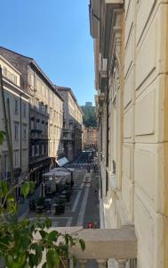 a view of a city street from a building at Hotel Centrale in Trieste